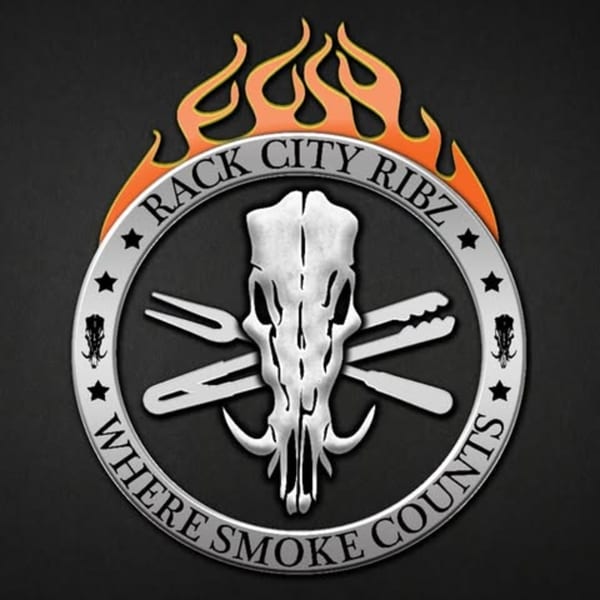 Rack City Ribz logo with a flaming border, boar skull, crossed utensils, and "Where Smoke Counts".